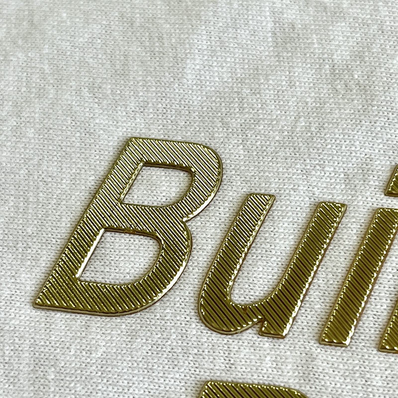 Metallic Gold Embossed Letters Iron - on Badge